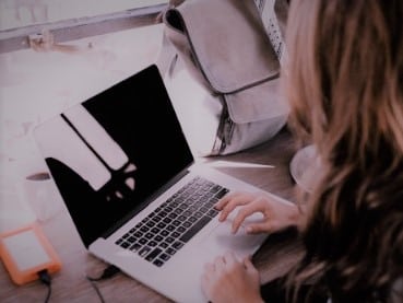 girl on laptop home study